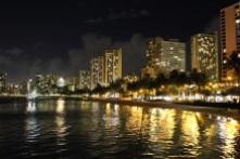 Waikiki Beach in Honolulu Hawaii at Night with City Lights on the Beach