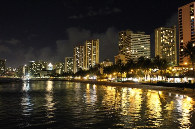 Waikiki Beach in Honolulu Hawaii at Night with City Lights on the Beach